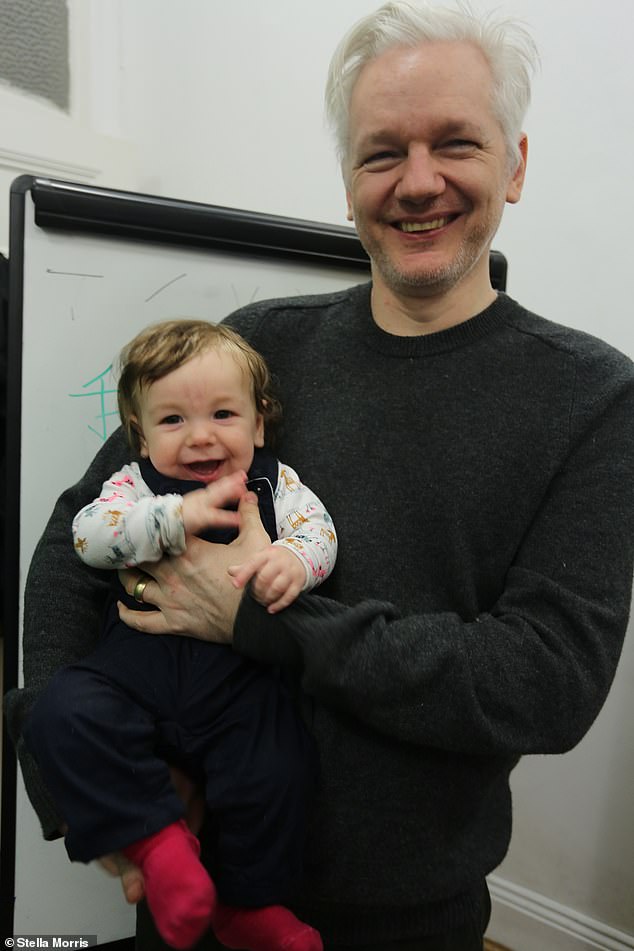 At the time that Gabriel was conceived in 2016, Assange had been inside the Ecuadorian embassy, close to Harrods, for four years and was believed to be under constant surveillance by American security services. Pictured: Assange with Gabriel as a baby
