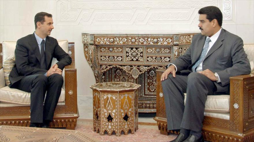 Bashar al-Asad (izda.) y Nicolás Maduro, presidente de Siria y Venezuela, respectivamente.