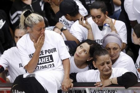 epa10717397 Nahel's mother (2-L), wearing a 'Justice for Nahel' T-shirt, reacts as she attends a march in the memory of her 17-year-old son who was killed by French Police in Nanterre, near Paris, France, 29 June 2023. Violence broke out after the police fatally shot a 17-year-old during a traffic stop in Nanterre on 27 June. According to the French interior minister, 31 people were arrested with 2,000 officers being deployed to prevent further violence.  EPA/YOAN VALAT