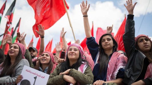 Palestinian students supporting the Popular Front for the Liberation of Palestine (PFLP) movement take part in a rally during an election campaign rally for the student council at the Birzeit University, near the West Bank city of Ramallah. (Photo by Ahmad Talat/NurPhoto via Getty Images)