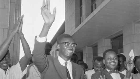 (Original Caption) Wave of Confidence. Leopoldville, Congo: Flushed with victory, Congolese Premier Patrice Lumumba waves as he leaves the National Senate, Sept. 8th. Lumumba had just received a 41-2 vote of confidence.